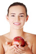 Photo: Happy fit teen woman with apple Happy fit teen woman with apple