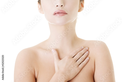 Photo: Beautiful sensual young woman touching her chest Beautiful sensual young woman touching her chest