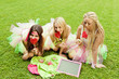 group of beautiful female friends smiling.  three pretty  girls