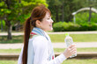 Beautiful young woman running in the park