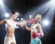 Two pretty women boxing