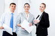Photo: Three young business people laughing Three young business people laughing