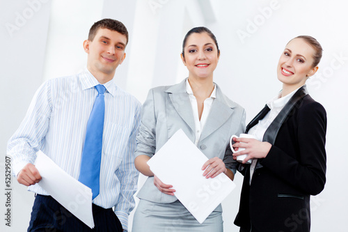 Photo: Three young business people laughing Three young business people laughing