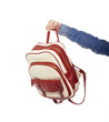 	student holding backpack