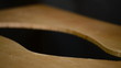 Luthier shapes the wood with hacksaw to a flamenco guitar