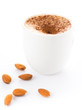 Coffee with milk an almond  in a cup on a white background
