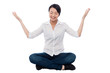 Pretty girl practicing meditation smilingly