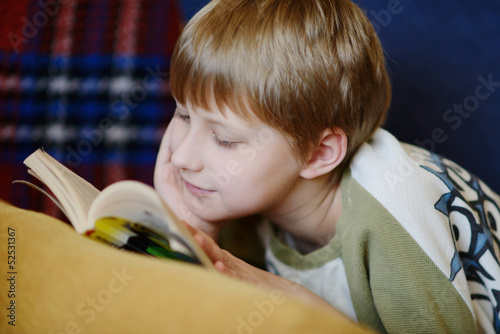 Photo: boy reading at home boy reading at home