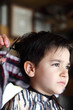 Young boy at barber shop