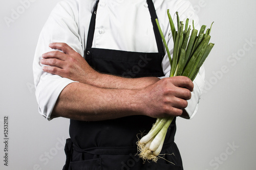 Photo: chef holding spring onions chef holding spring onions