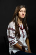Ukrainian girl in the traditional blouse embroidered