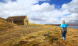 girl walking at cow green reservoir uk
