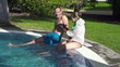Young couple having fun by the pool