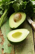 ripe avocado cut in half on a wooden table