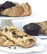 Continental breakfast table setting with pastries and cakes