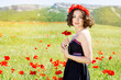 Young girl  in poppies field