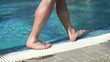 Man walking by the pool, super slow motion, shot at 240fps