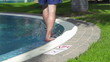 Man walking by the pool, super slow motion, shot at 240fps