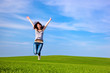 Young beautiful woman jumping for joy