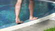 Man walking by the pool