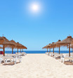 Gorgeous summer day at the beach near the sea. Beach umbrellas a