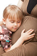 Pregnant woman with daughter