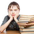 Tired child with stack of books