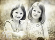Photo: Old photo of happy children lying on green grass outdoors Old photo of happy children lying on green grass outdoors