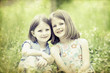 Photo: Old photo of happy children lying on green grass outdoors Old photo of happy children lying on green grass outdoors