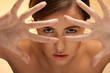 Photo: futuristic woman face looking through fingers futuristic woman face looking through fingers