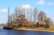 House in the countryside with grassland and canal
