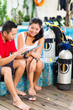 Dive master and student in Asian diving school
