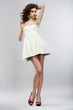 Fashion Style. Woman in Light White Dress. Summer Collection