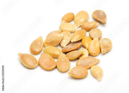 Photo: Pumpkin seeds on a white background. macro Pumpkin seeds on a white background. macro
