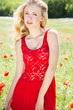 beautiful blonde girl in poppies field