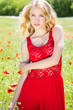 beautiful blonde girl in poppies field