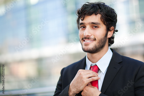 Photo: Confident businessman in an urban setting Confident businessman in an urban setting