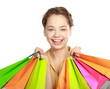 Young girl holding shopping bag, isolated on white background