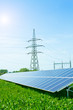 solar panel against high voltage towers