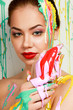 Photo: Beautiful woman painted with many vivid colors. Beautiful woman painted with many vivid colors.