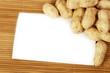 Tasty nuts with white blank paper