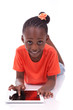 Little african american girl using a tablet pc