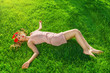 Young woman lying on grass