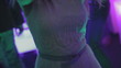 Girl in white dress is dancing in club
