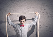 Businessman holding rope