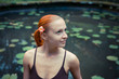 Photo: Portrait of red young woman with flower Portrait of red young woman with flower