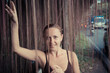Photo: Young woman standing in thick jungle vegetation Young woman standing in thick jungle vegetation