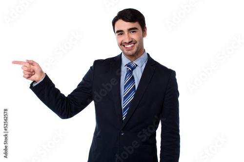 Photo: Smart businessman pointing at something Smart businessman pointing at something