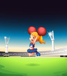 A cute cheerleader performing at the field