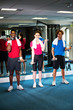 Photo: Group of people doing biceps exercise Group of people doing biceps exercise